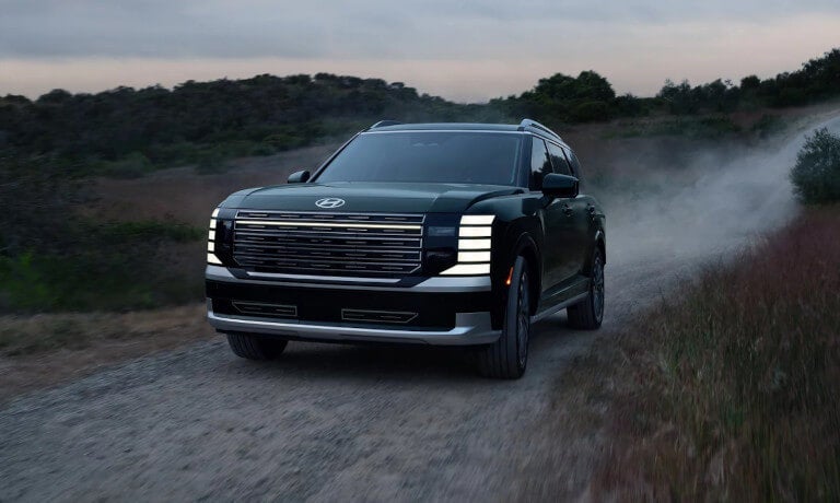2026 Hyundai Palisade driving on a dirt road