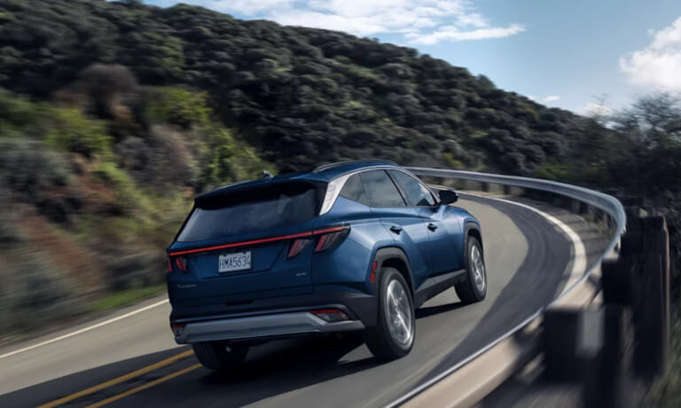 2026 Hyundai Tucson driving fast on curve